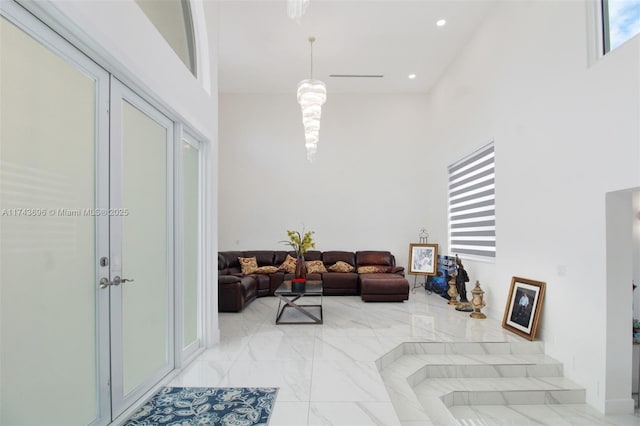 living room with a towering ceiling