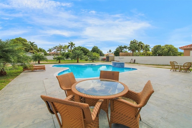 view of swimming pool featuring a patio