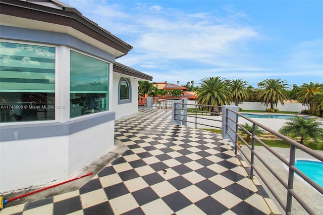 view of patio / terrace featuring a fenced in pool