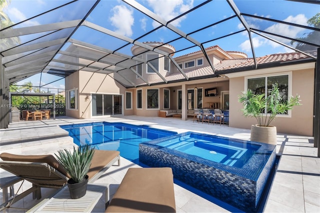 view of swimming pool featuring an in ground hot tub, an outdoor living space, a lanai, and a patio area