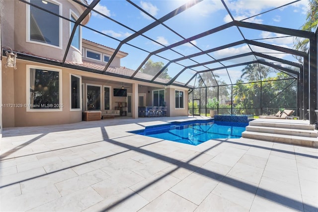 view of pool with a lanai, a patio, and exterior bar