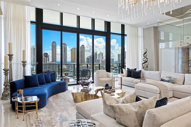 living area with a view of city, an inviting chandelier, and a wall of windows