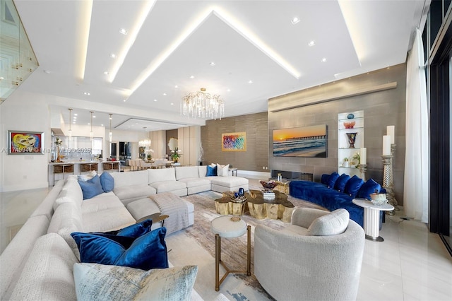 living area with recessed lighting and a notable chandelier