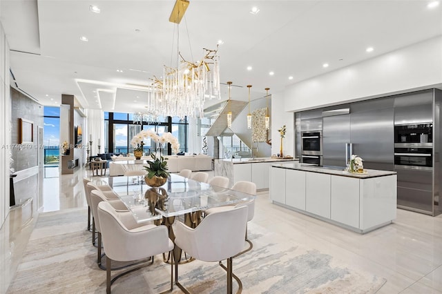 5000 Island Estates Dr Unit Ph1508, Aventura, FL 33160 - dining area with a chandelier, recessed lighting, and floor to ceiling windows