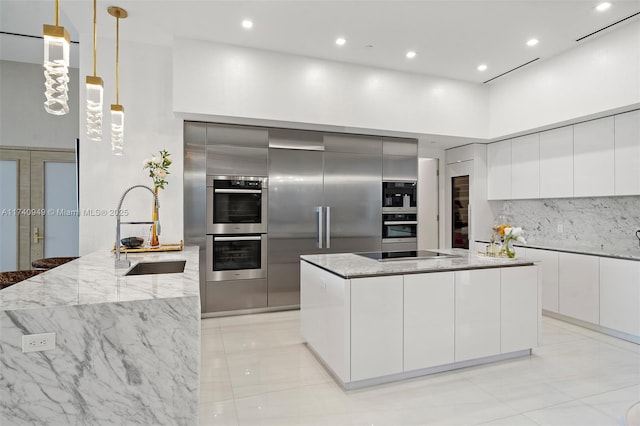 5000 Island Estates Dr Unit Ph1508, Aventura, FL 33160 - kitchen featuring modern cabinets, a sink, tasteful backsplash, light stone counters, and recessed lighting