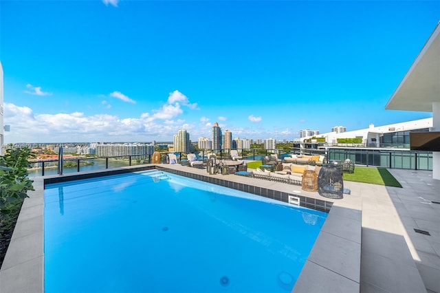 view of swimming pool with a view of city