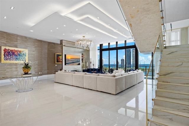 5000 Island Estates Dr Unit Ph1508, Aventura, FL 33160 - tiled living room featuring a chandelier, expansive windows, stairway, and recessed lighting