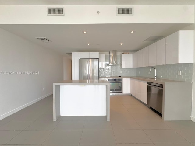 kitchen with visible vents, appliances with stainless steel finishes, and a sink