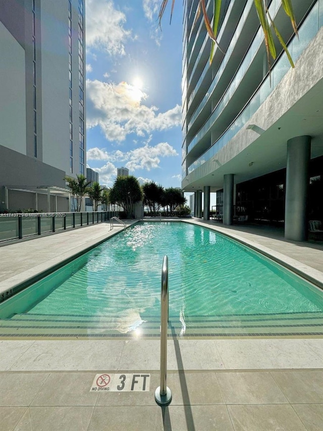 community pool with a patio