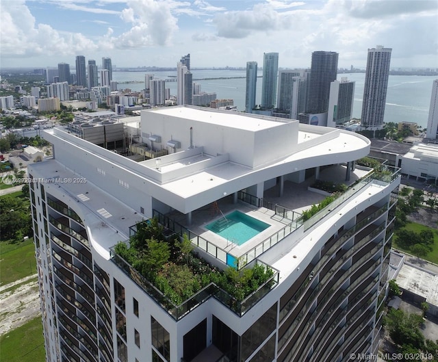 bird's eye view featuring a city view and a water view