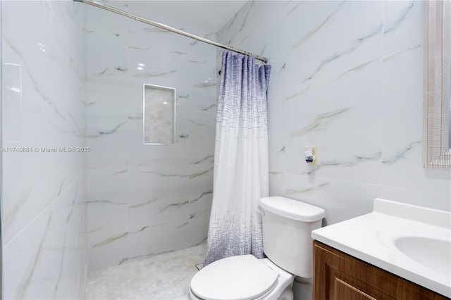 bathroom with toilet, a marble finish shower, and vanity