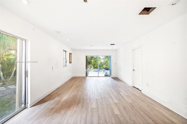 spare room with light hardwood / wood-style floors