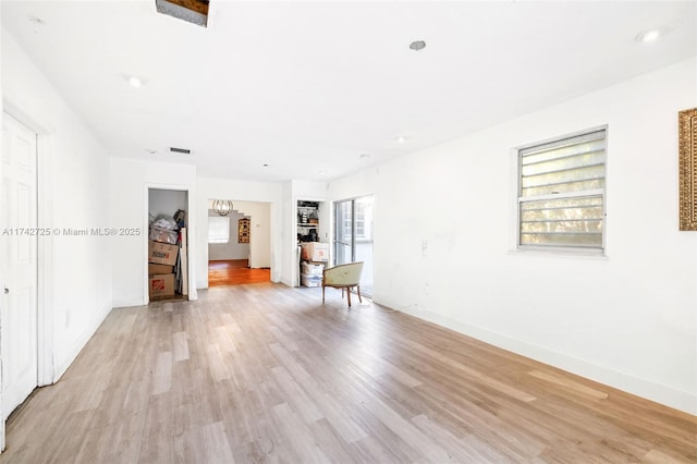 unfurnished living room featuring light hardwood / wood-style flooring