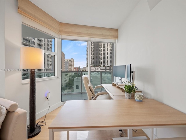 office space with light hardwood / wood-style floors