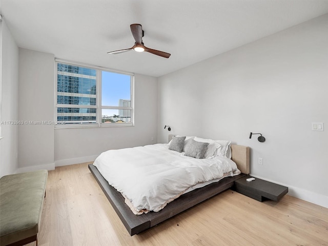 bedroom featuring wood-type flooring and ceiling fan