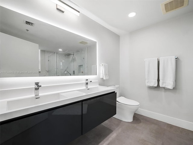 bathroom with walk in shower, vanity, and toilet