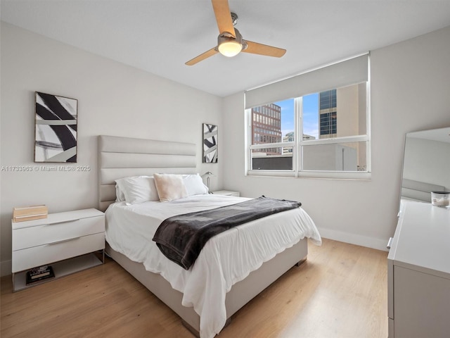 bedroom featuring ceiling fan and light wood-type flooring