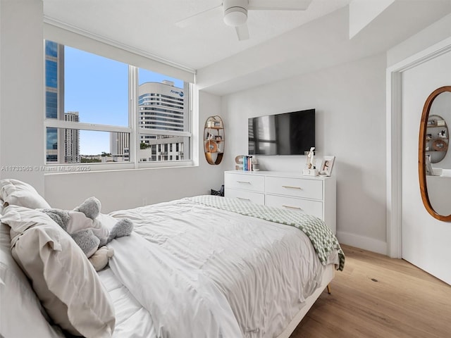 bedroom featuring ceiling fan and light wood-type flooring