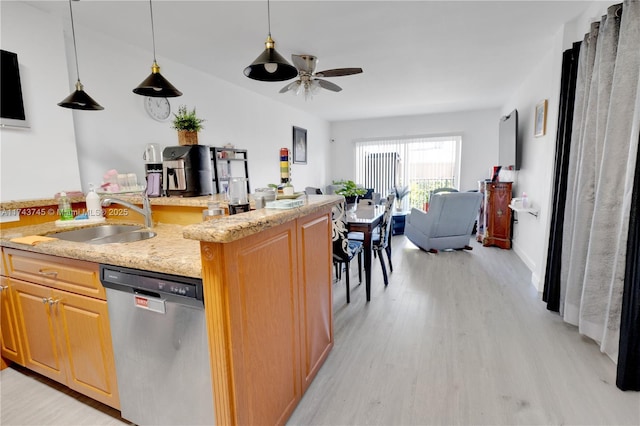 kitchen with sink, light stone counters, light wood-type flooring, dishwasher, and ceiling fan