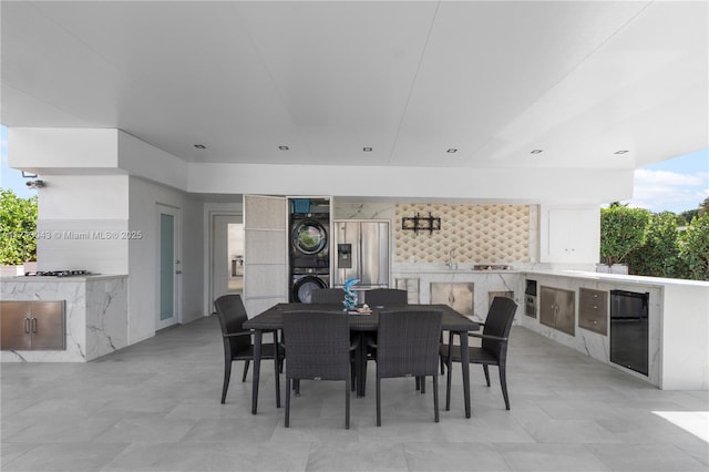 dining area with stacked washer / dryer