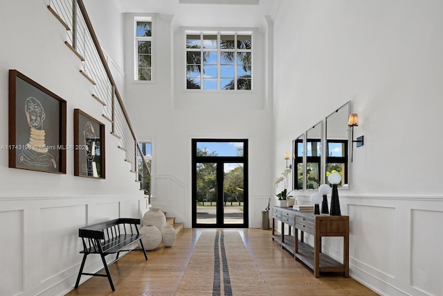 entrance foyer with light wood-type flooring and french doors