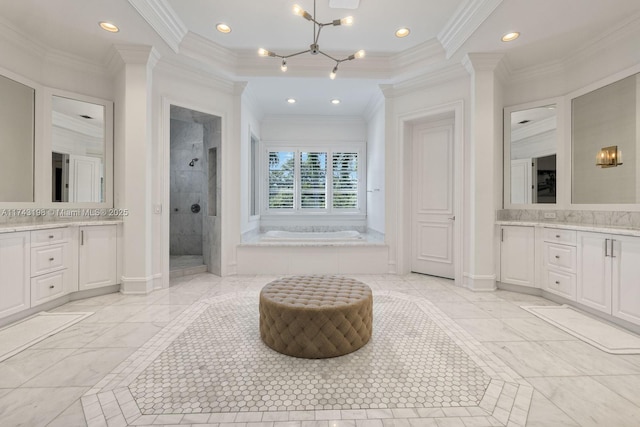 bathroom with crown molding, decorative columns, separate shower and tub, vanity, and a chandelier