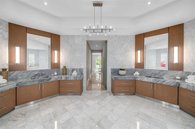 bathroom with vanity and a tray ceiling