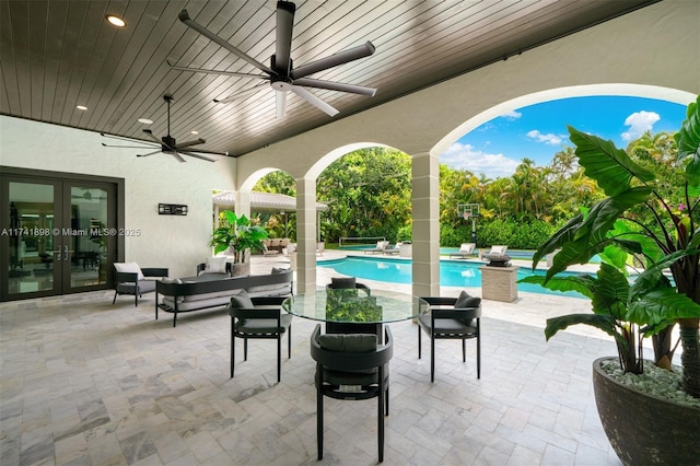 view of patio with french doors, ceiling fan, and outdoor lounge area