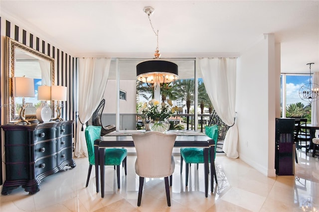 dining space featuring an inviting chandelier, a wall of windows, and light tile patterned floors