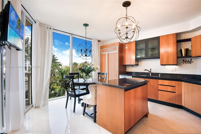 kitchen with pendant lighting, a kitchen bar, expansive windows, a center island, and an inviting chandelier