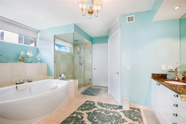 bathroom featuring an inviting chandelier, tile patterned floors, vanity, and shower with separate bathtub