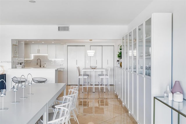 dining area featuring sink