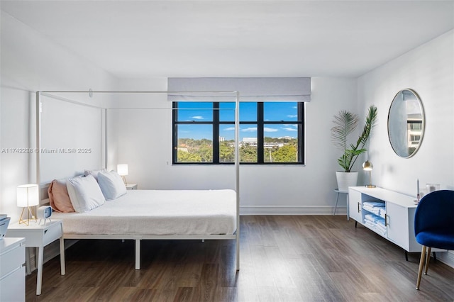 bedroom featuring dark wood-type flooring