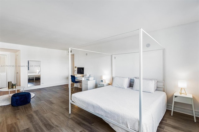 bedroom featuring dark hardwood / wood-style flooring