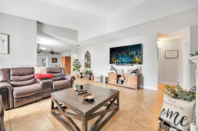 living room with a textured ceiling and light tile patterned floors