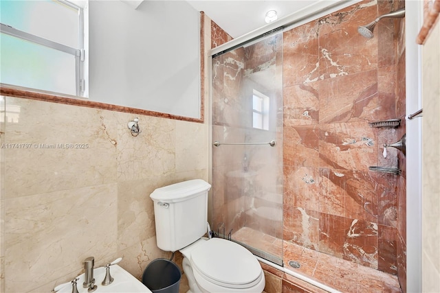 bathroom with a bidet, a shower with shower door, tile walls, and toilet