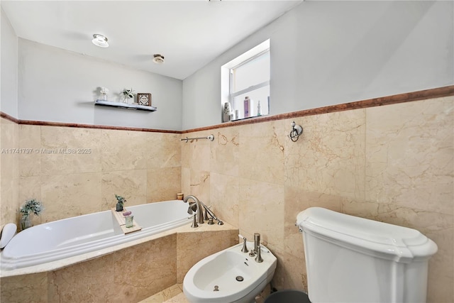 bathroom featuring a bidet, a relaxing tiled tub, toilet, and tile walls