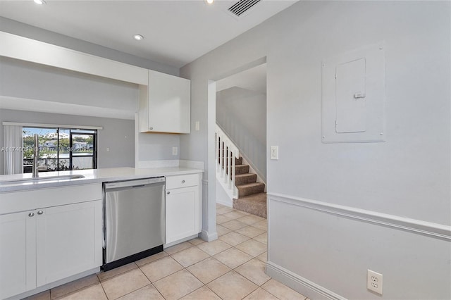 kitchen featuring light countertops, visible vents, white cabinetry, electric panel, and dishwasher