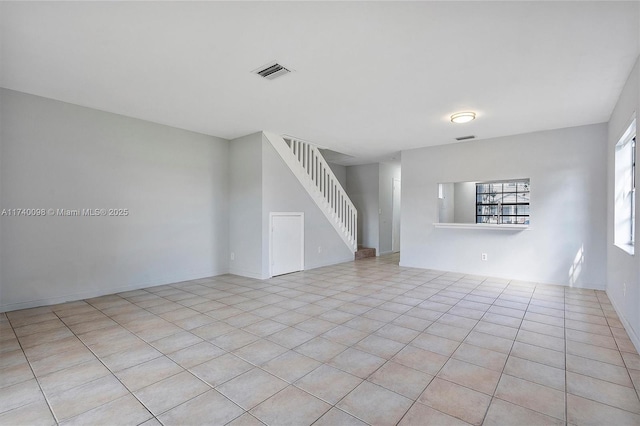 interior space with stairs and visible vents