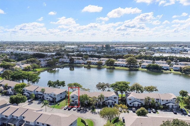 birds eye view of property featuring a water view and a residential view