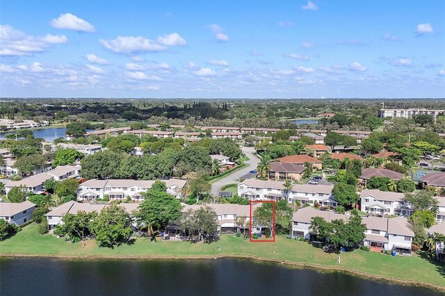 birds eye view of property featuring a water view and a residential view