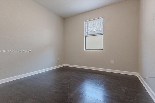 unfurnished room featuring dark hardwood / wood-style flooring