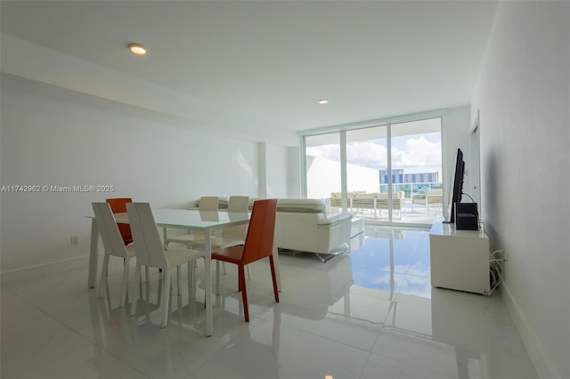 dining room featuring floor to ceiling windows