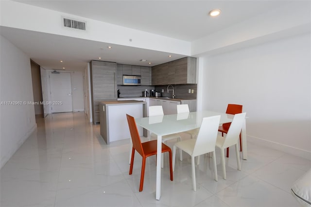 dining room featuring sink