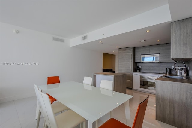 dining room featuring sink