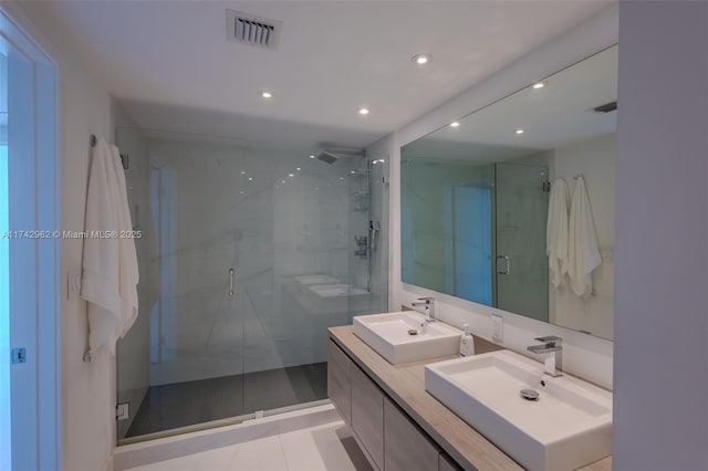 bathroom with an enclosed shower and vanity