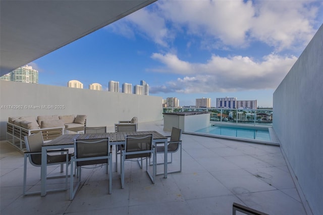 view of patio featuring a community pool and outdoor lounge area