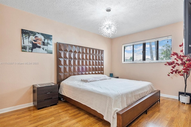 4149 S Pine Island Rd, Davie, FL 33328 - bedroom featuring wood finished floors and a textured ceiling