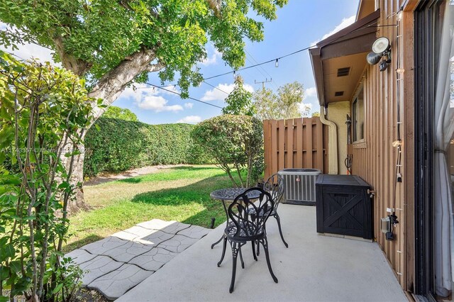 4149 S Pine Island Rd, Davie, FL 33328 - view of patio / terrace featuring central AC and fence