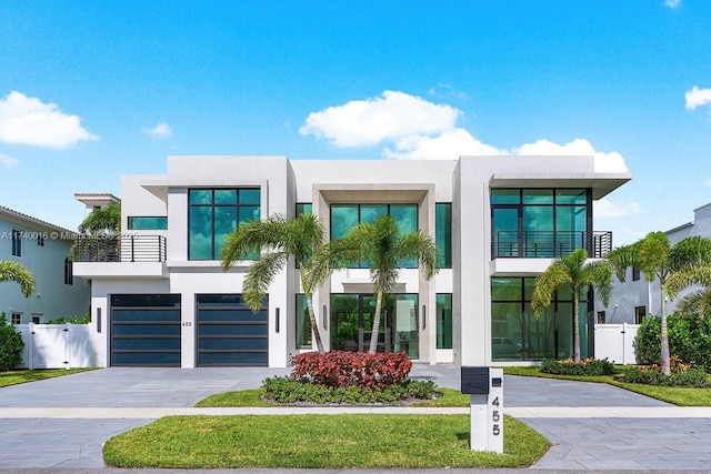 contemporary house featuring a balcony and a garage